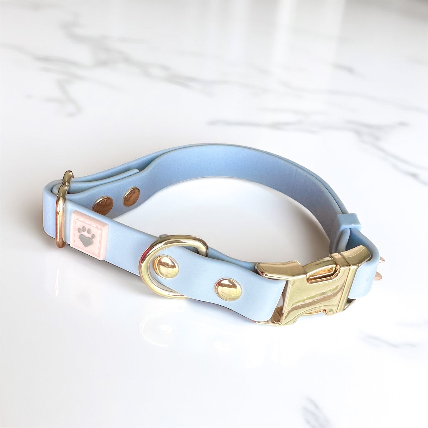 Serenity Blue waterproof dog collar with light gold hardware, made to protect, comfort, and reflect the special bond you share with your dog.